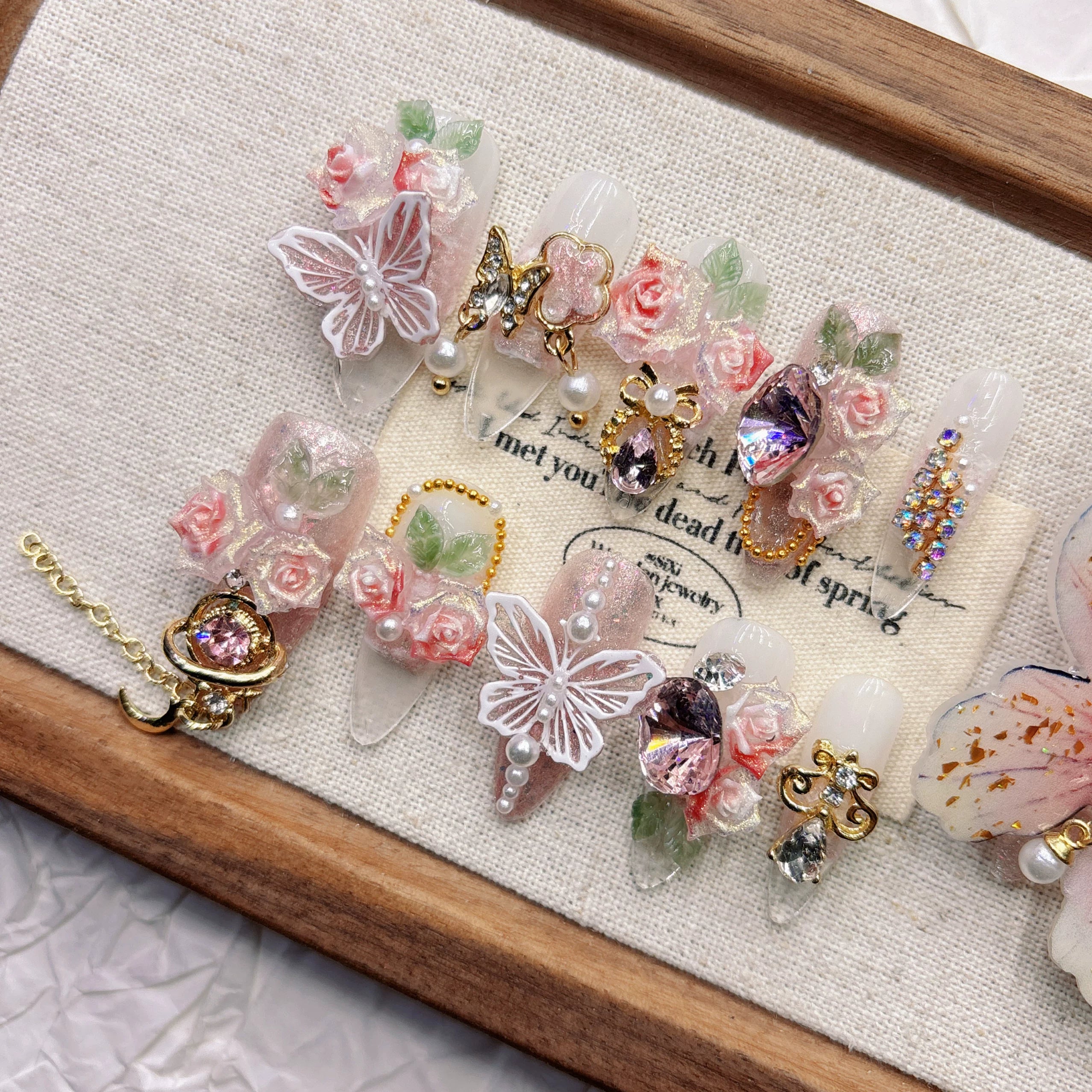Pink 11-finger butterfly pure hand-worn nail high-end sense white nail art three-dimensional flower 2026 medium and long