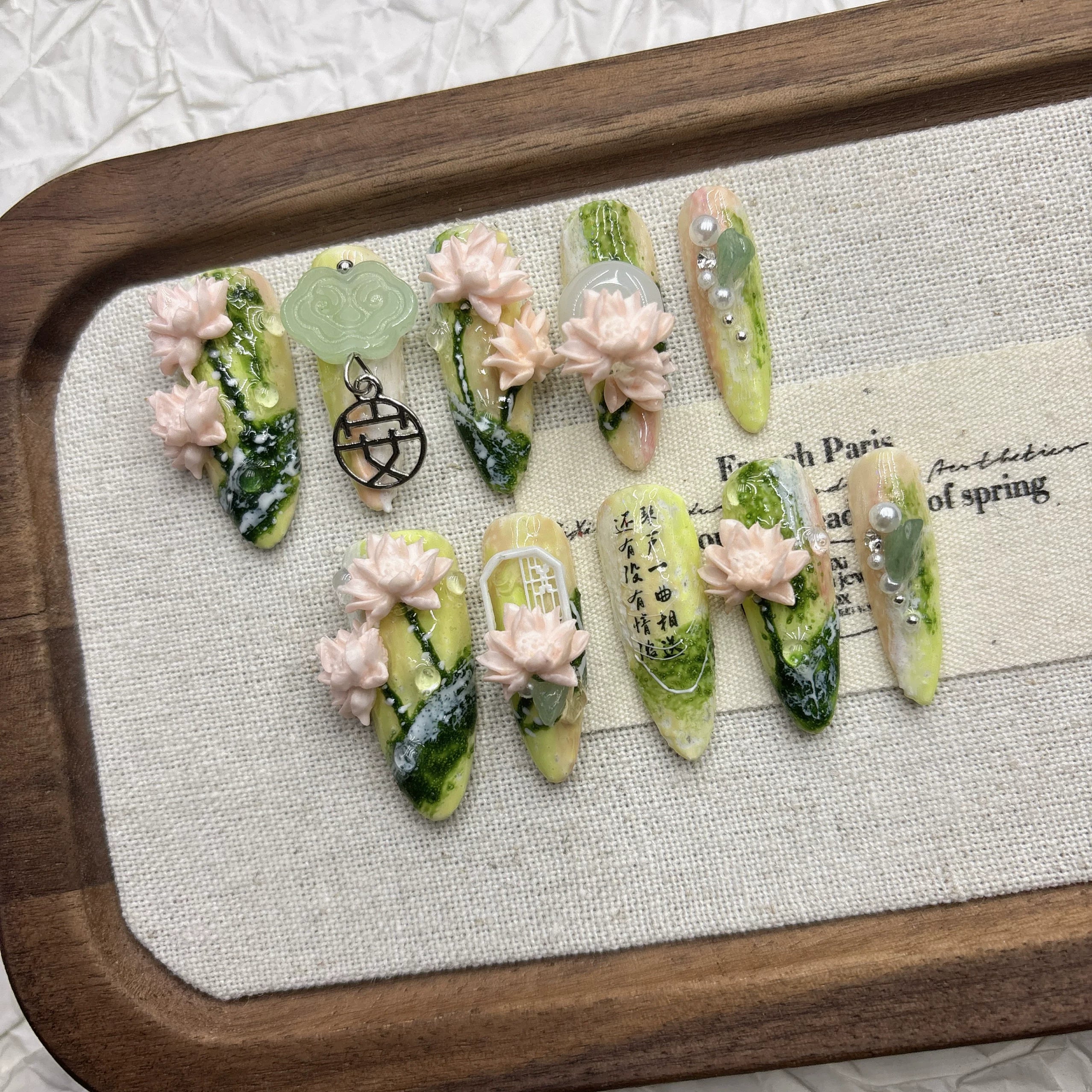 Spring green lotus manicure, pure hand-worn armor, national style relief three-dimensional light luxury 2026 new medium and long models