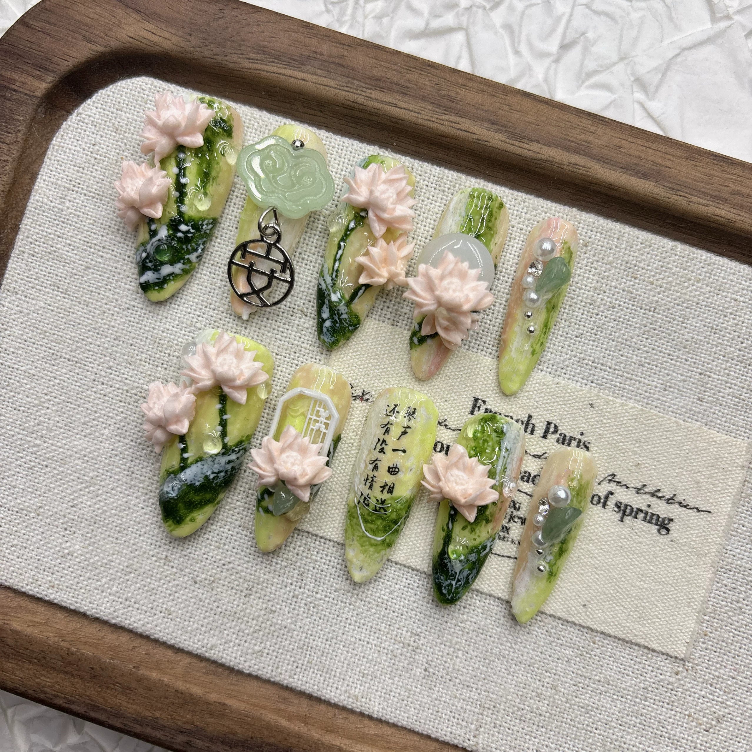 Spring green lotus manicure, pure hand-worn armor, national style relief three-dimensional light luxury 2026 new medium and long models