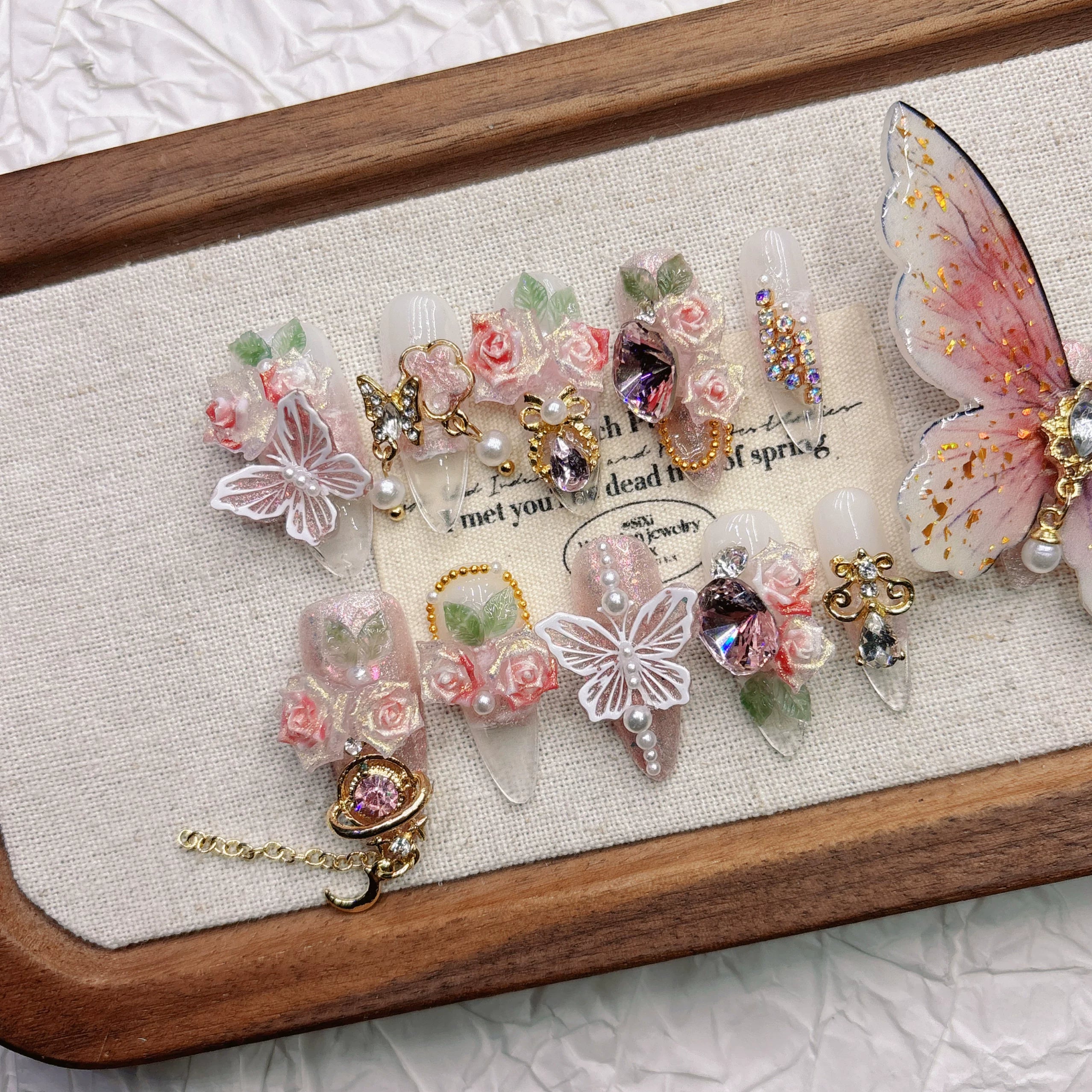 Pink 11-finger butterfly pure hand-worn nail high-end sense white nail art three-dimensional flower 2026 medium and long